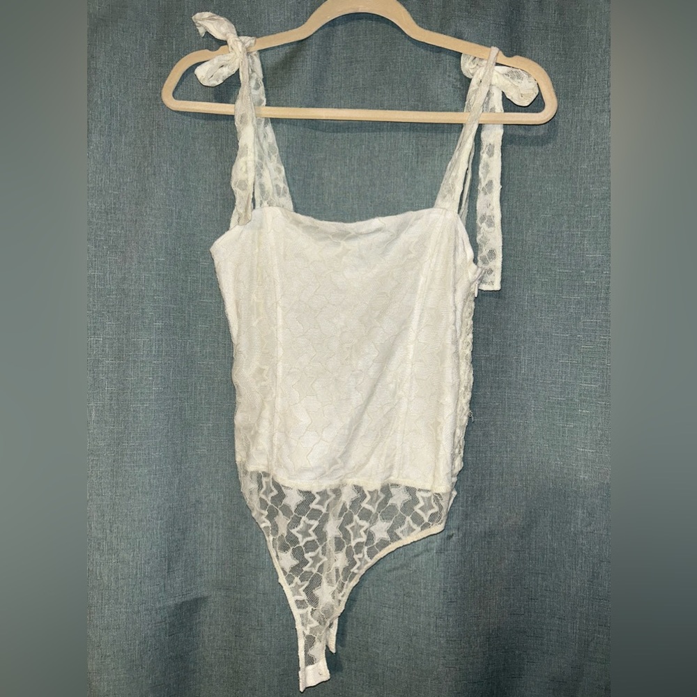 White star pattern lace body suit with bow tie shoulder straps